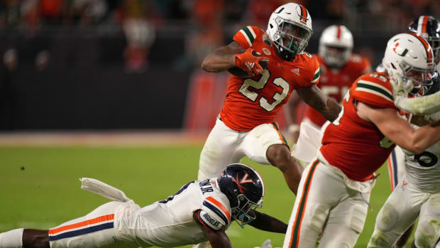 Sep 30, 2021; Miami Gardens, Florida, USA; Miami Hurricanes running back Cam'Ron Harris (23) runs the ball against the Virginia Cavaliers during the second half at Hard Rock Stadium. Mandatory Credit: Jasen Vinlove-USA TODAY Sports
